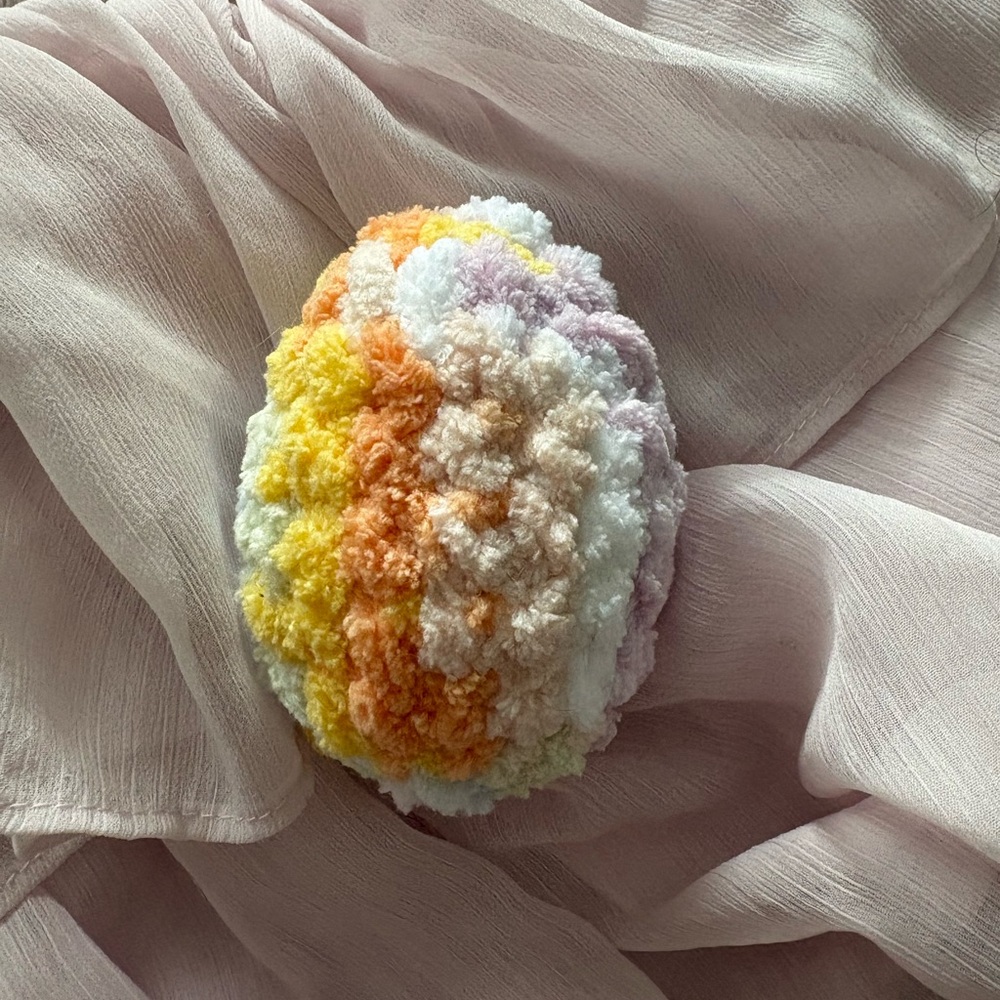 Soft, fuzzy, and squishy crochet large rainbow egg plush toy/stress ball